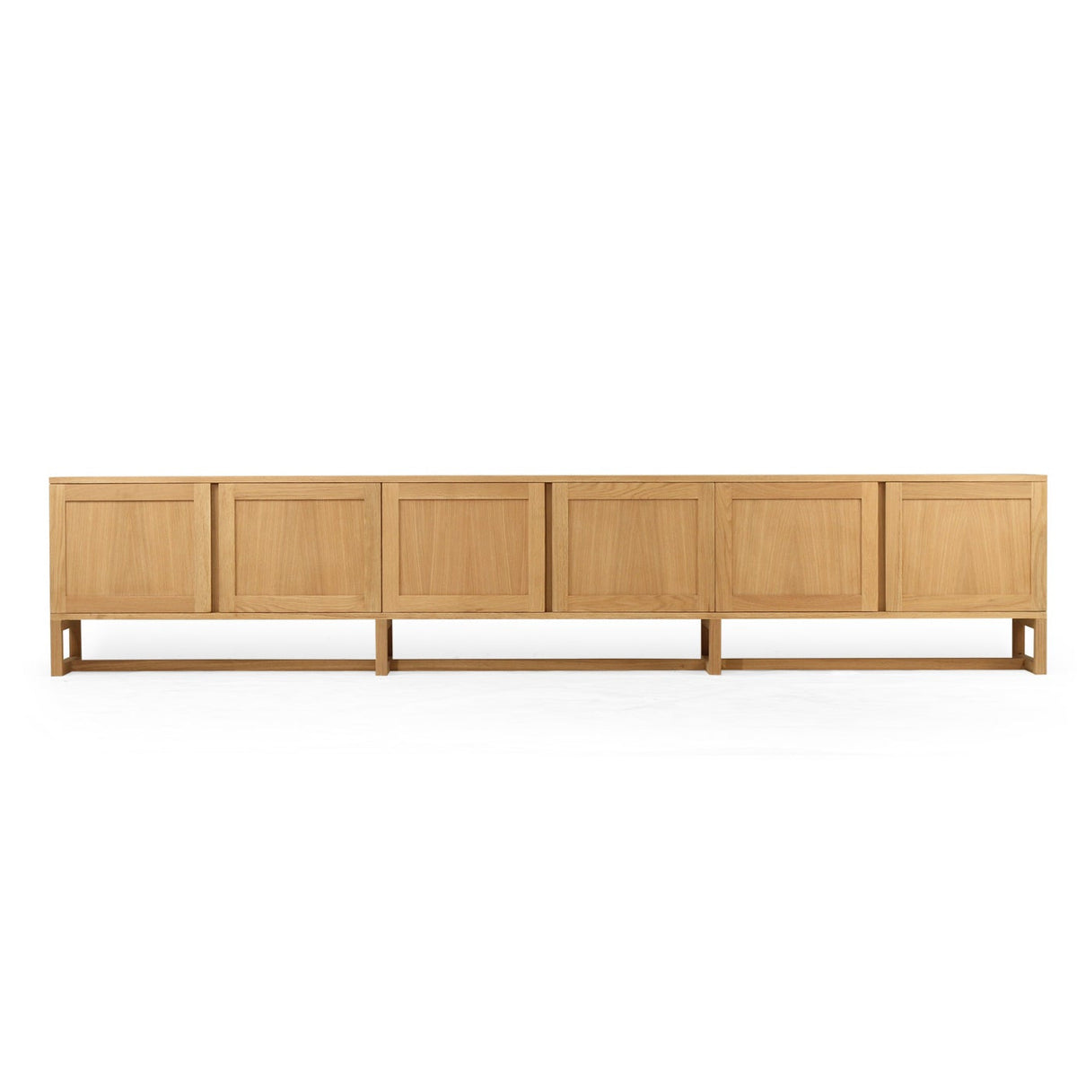 A modern six-panel sideboard cabinet in light oak wood, shown from a front-facing perspective against a solid white background.