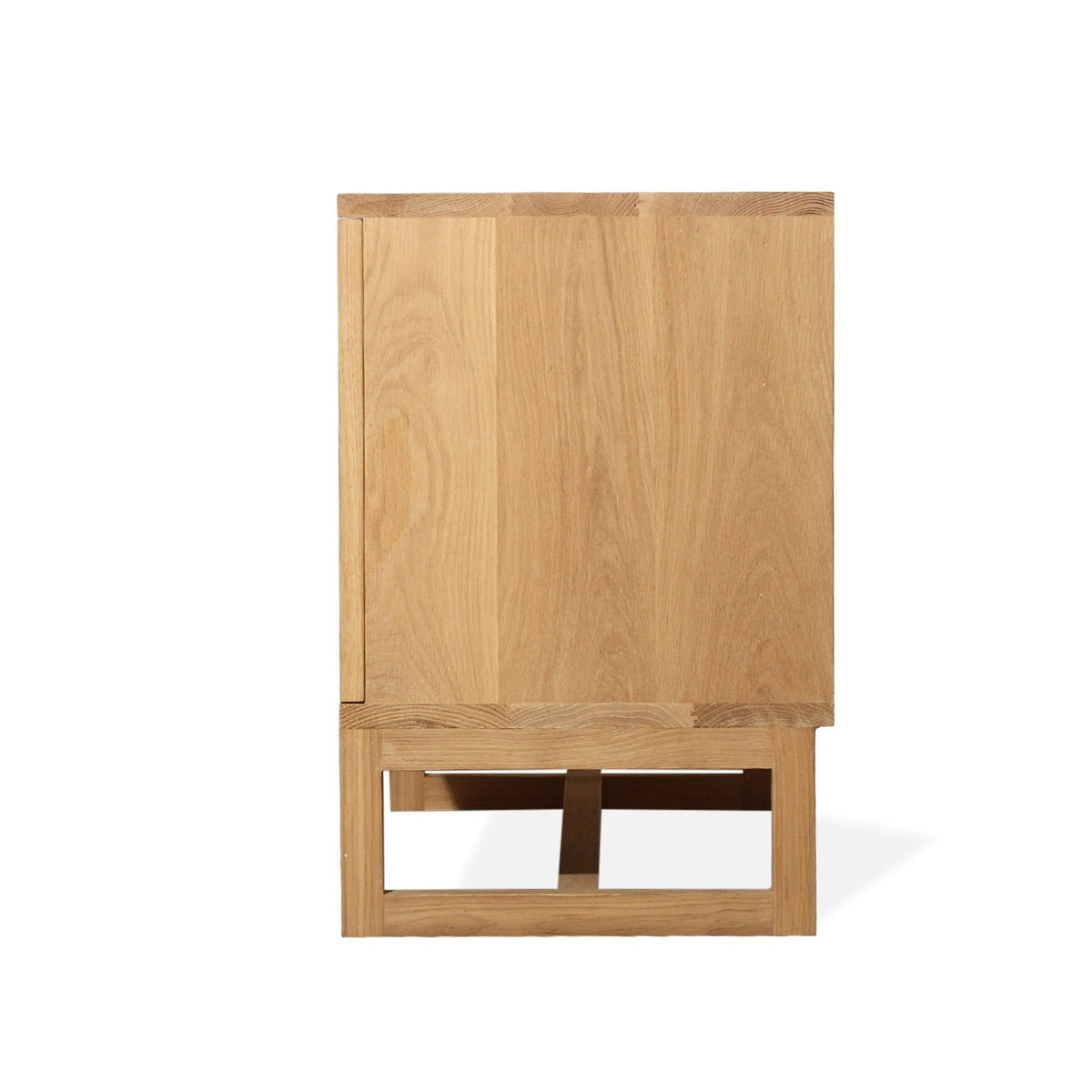 A light oak wood cabinet with a lower open shelf and a small wooden stool or step in front, shown against a plain white background.