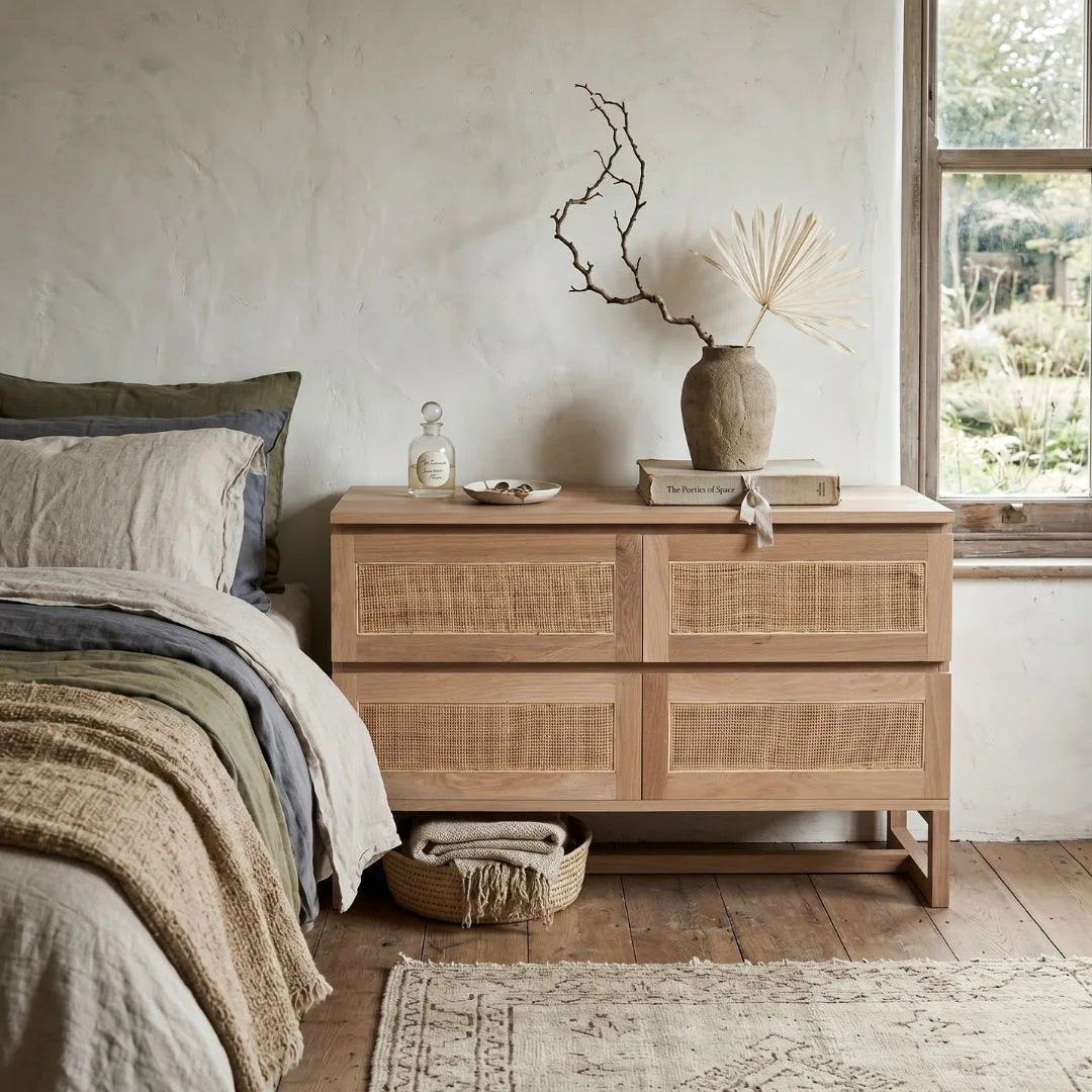 American Oak and rattan chest of drawers in a bedroom setting.