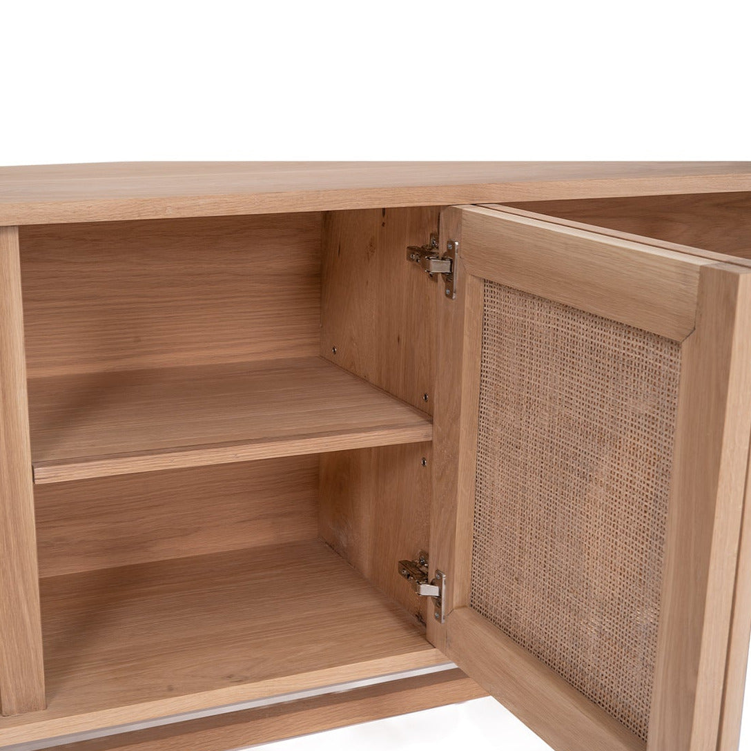 Wooden cabinet with open door revealing wicker interior on a white background