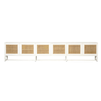 Product image of long white entertainment unit with six rectangular woven cane or rattan panels on the front, shown against a plain white background.
