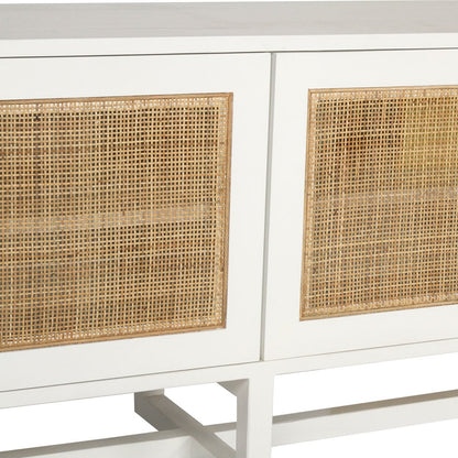 Close-up of a white cabinet or sideboard with woven cane or rattan panel inserts on the front.