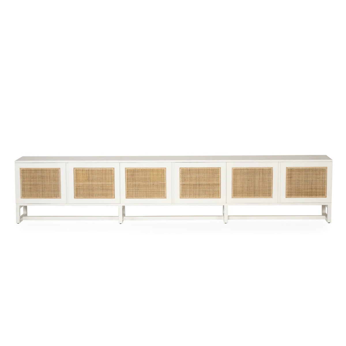 Product image of long white entertainment unit with six rectangular woven cane or rattan panels on the front, shown against a plain white background.