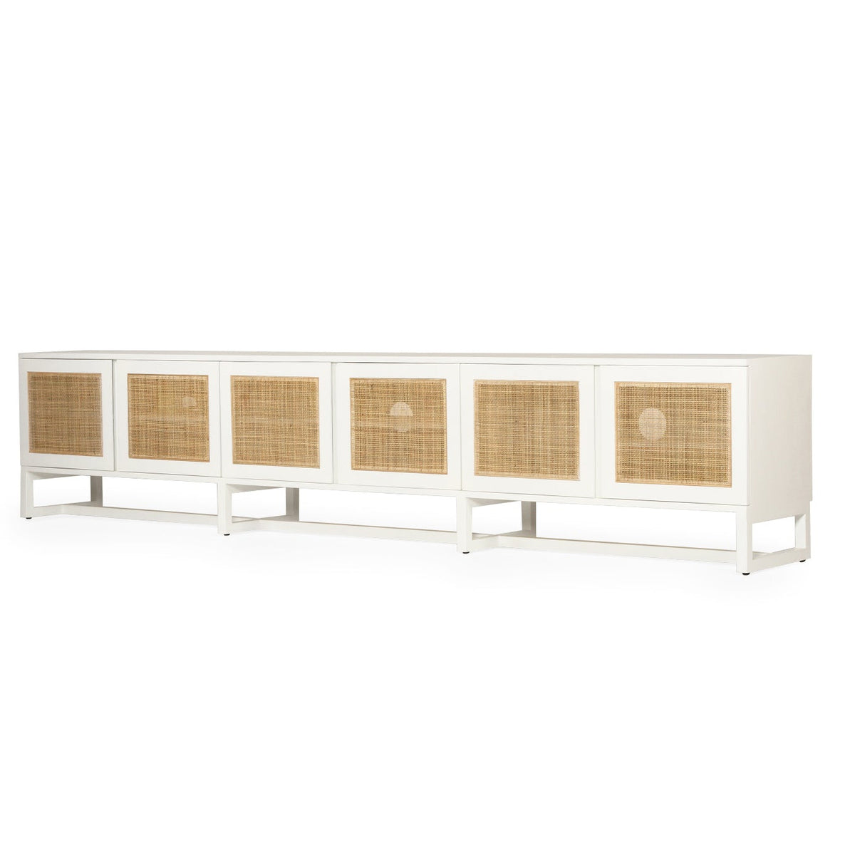 Product image of long white entertainment unit with six rectangular woven cane or rattan panels on the front, shown against a plain white background.