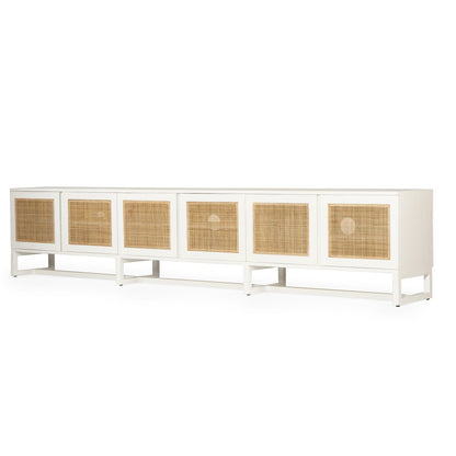 Product image of long white entertainment unit with six rectangular woven cane or rattan panels on the front, shown against a plain white background.