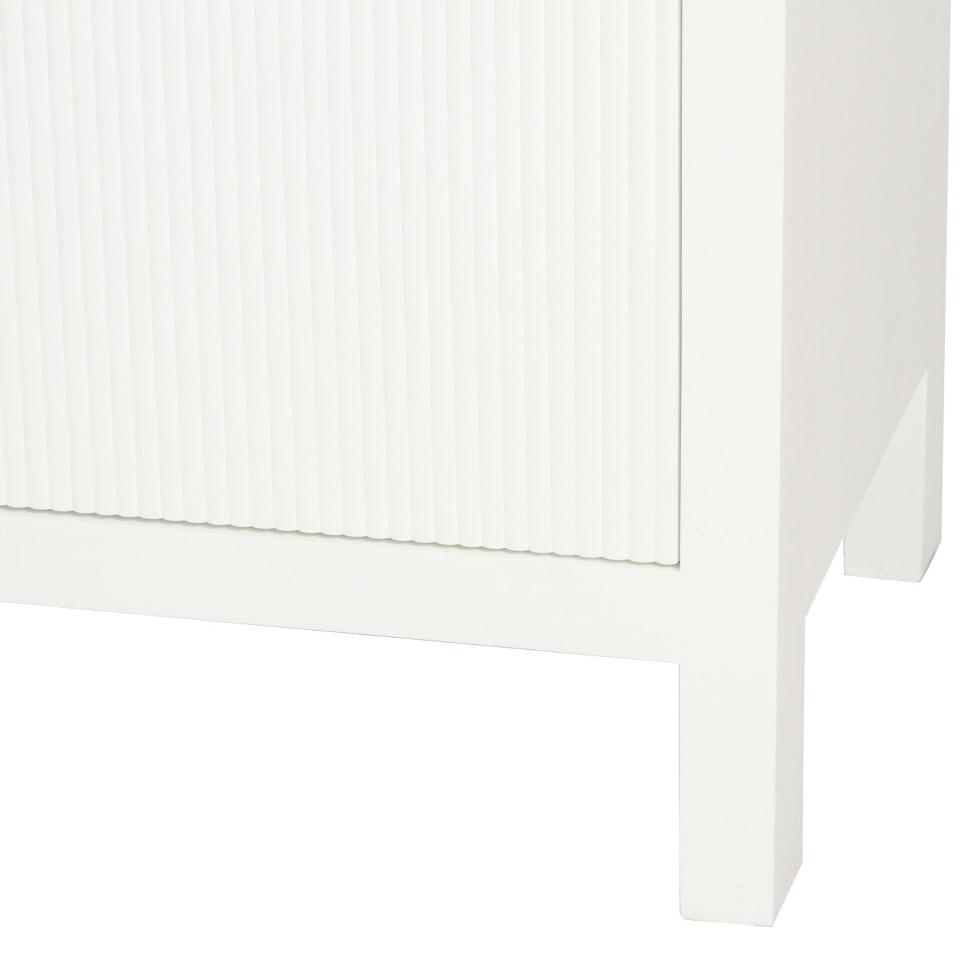 Close-up of a white cabinet corner with a textured finish