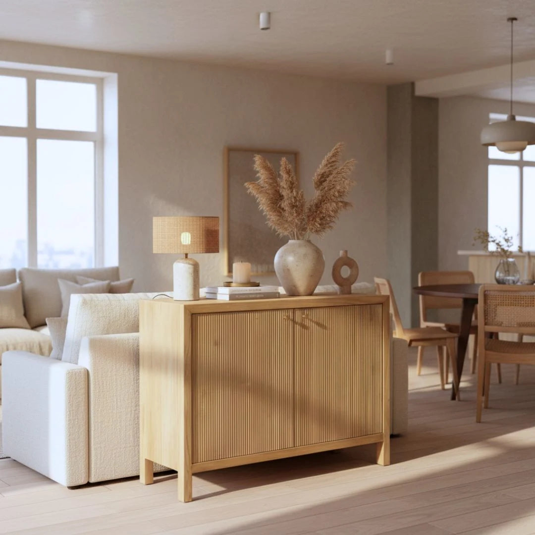 Living room with a wooden sideboard, white sofa, and decorative elements.