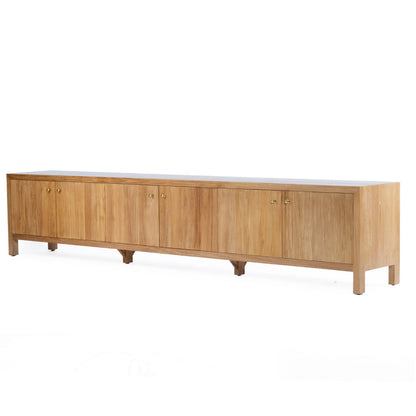 A mid-century modern wooden sideboard with a light natural wood finish, featuring six cabinet doors with small round knobs and tapered legs, shown against a plain white background.