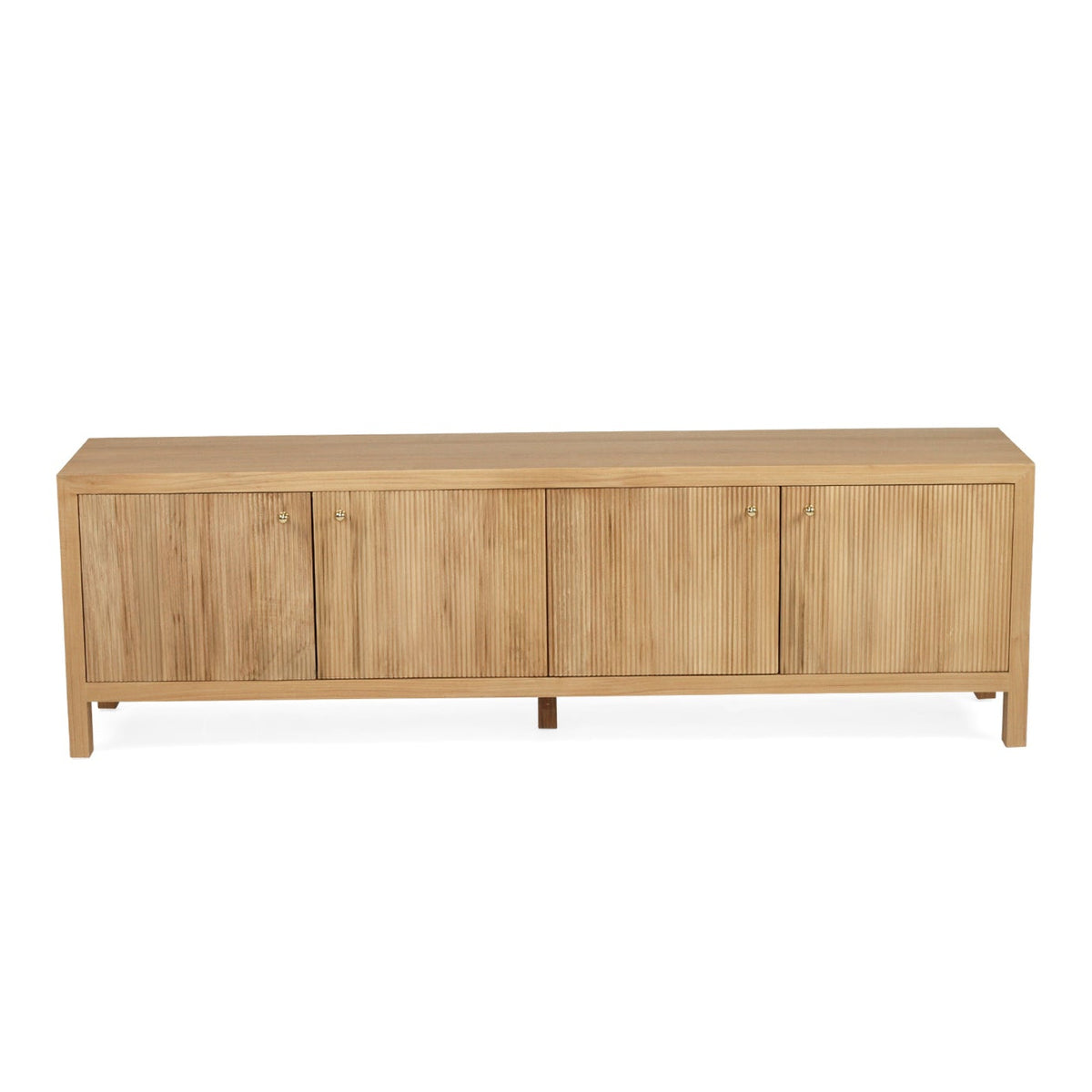 A modern light teak wood entertainment unit with four cabinet doors and tapered legs, shown against a plain white background.