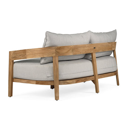 Wooden armchair with light gray cushions on a white background
