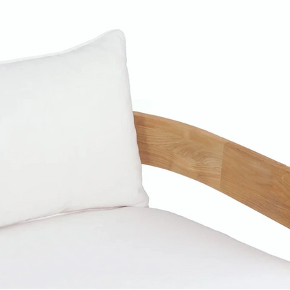 Wooden headboard with a white pillow on a white background