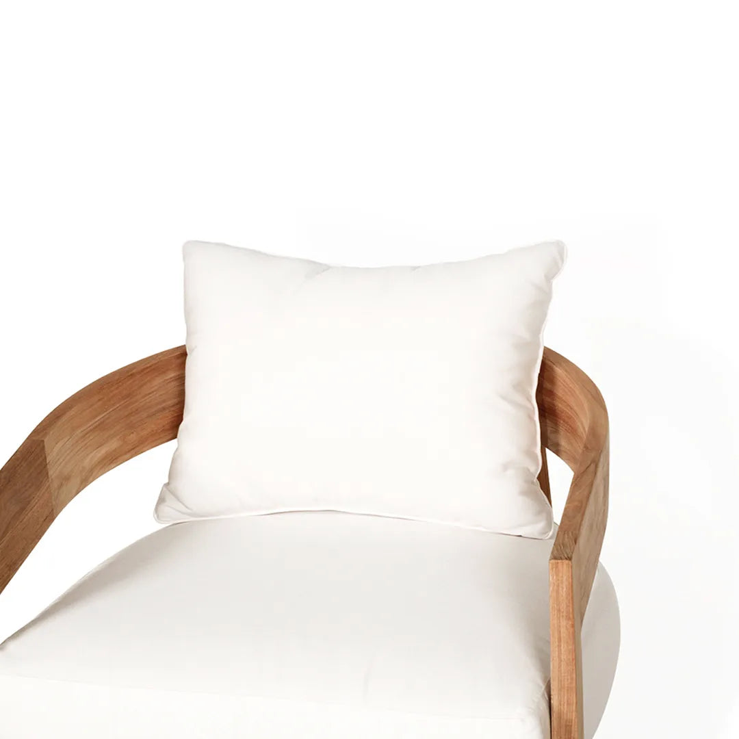 Teak outdoor armchair with white cushions on a white background