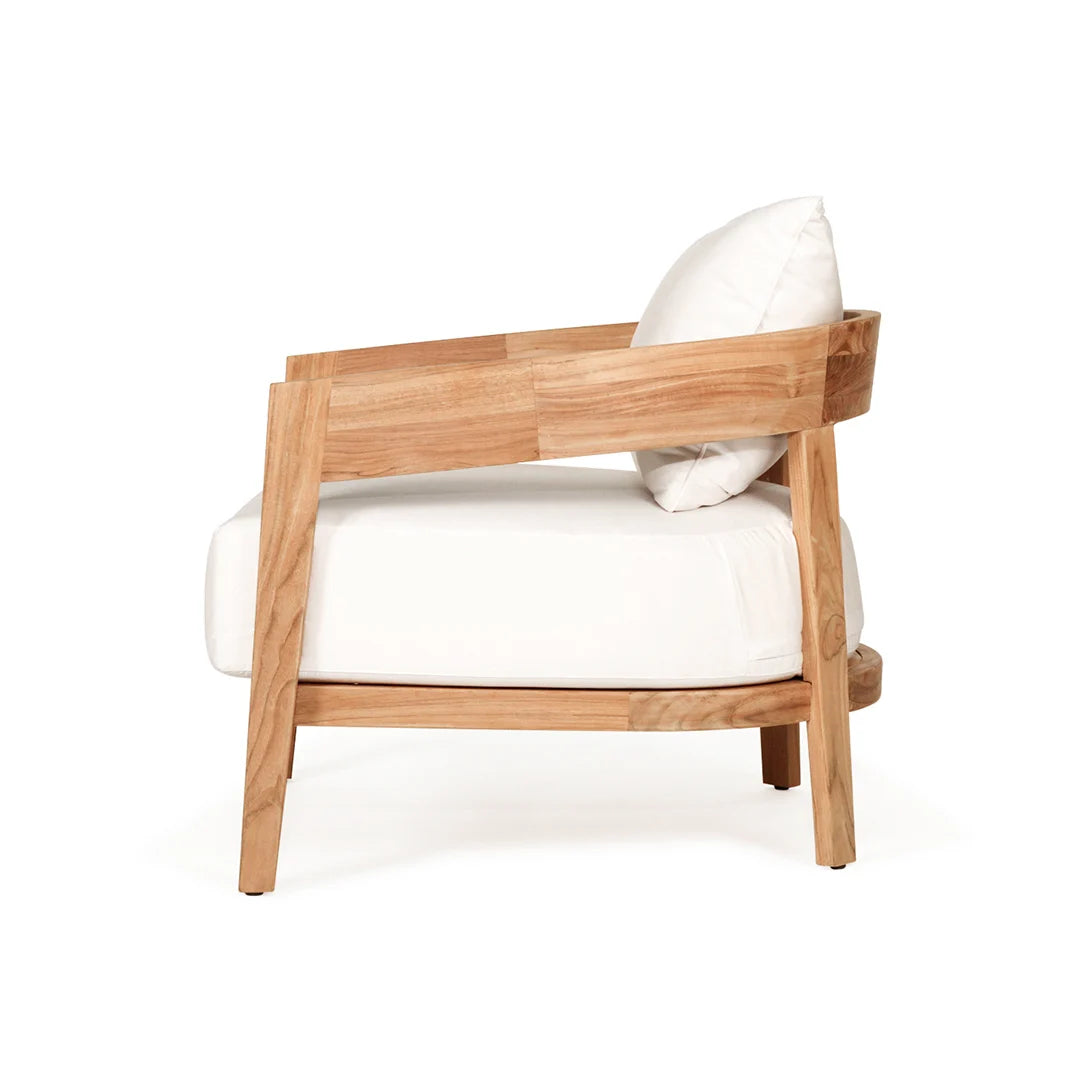 Teak outdoor armchair with white cushions on a white background