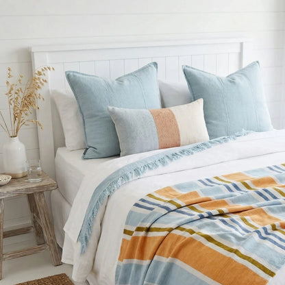 Sun Republic Sky luca and tallows cushion on a styled bed
