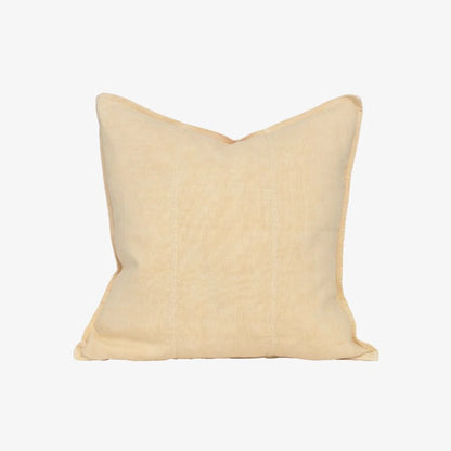 A square decorative throw pillow in a light cream or pale beige color, shown against a plain white background.