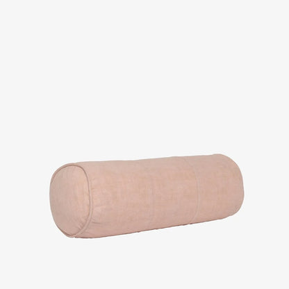 A cylindrical lumbar pillow in a light blush pink fabric, shown horizontally against a plain white background.