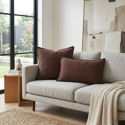 Gray sofa with brown cushions in a living room setting
