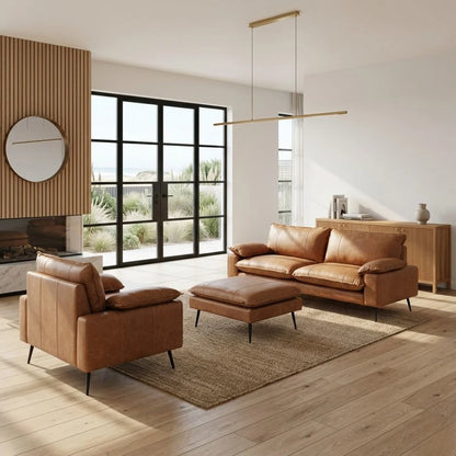 Modern living room with brown leather sofa, armchair, and ottoman.