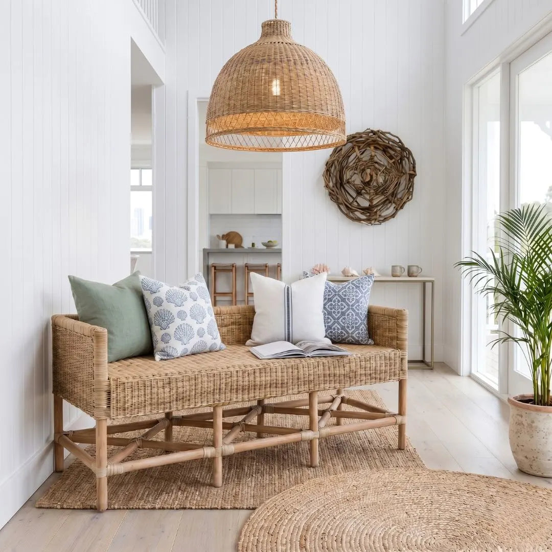 Wicker bench with cushions in a bright room with natural light