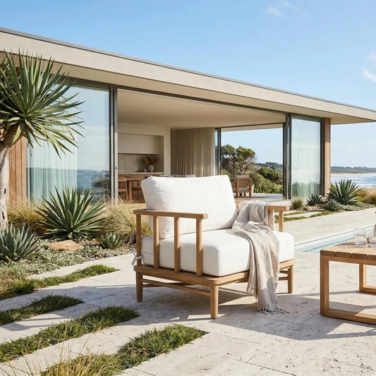 Outdoor patio with wooden furniture, table, and view of ocean.
