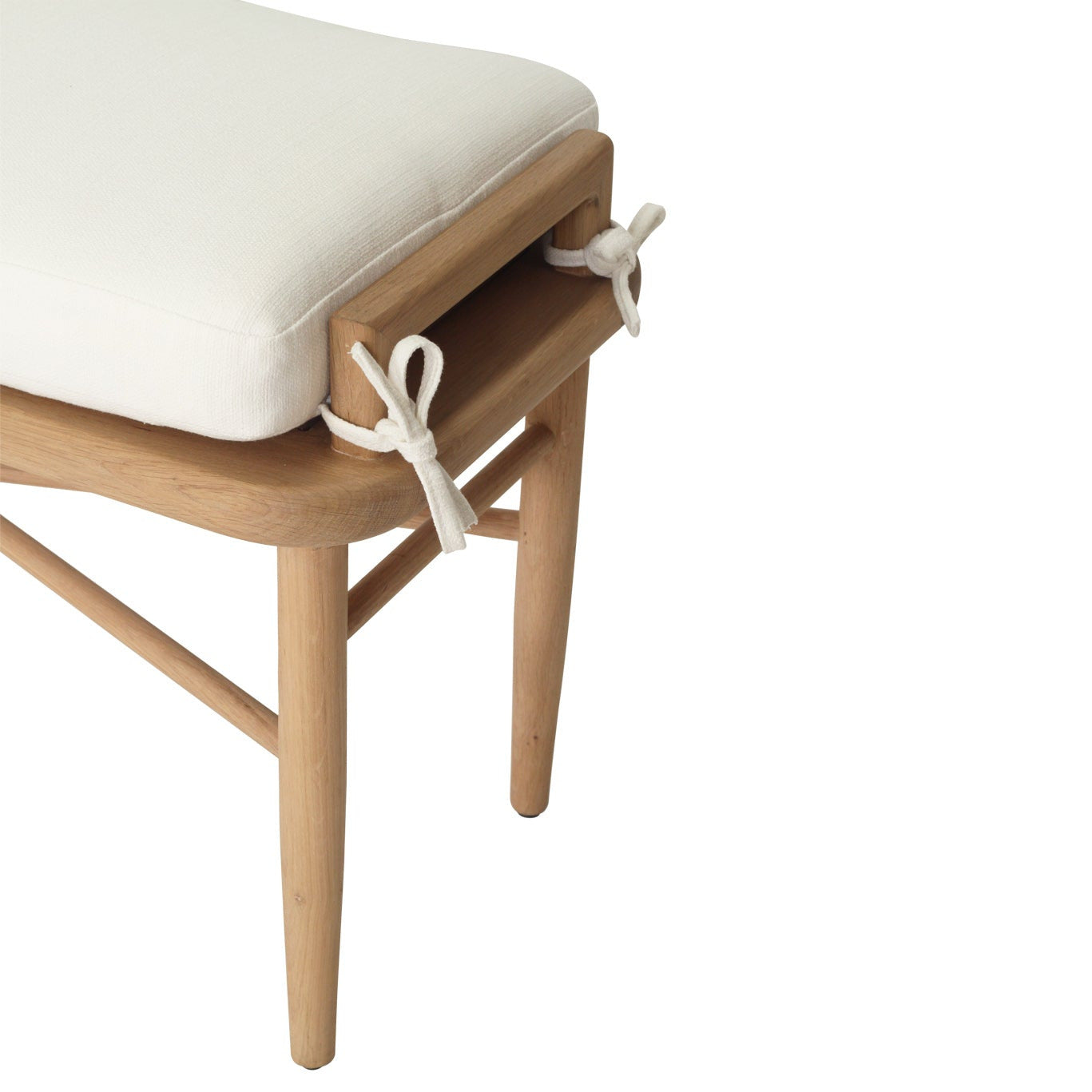 Wooden chair with a white cushion on a white background