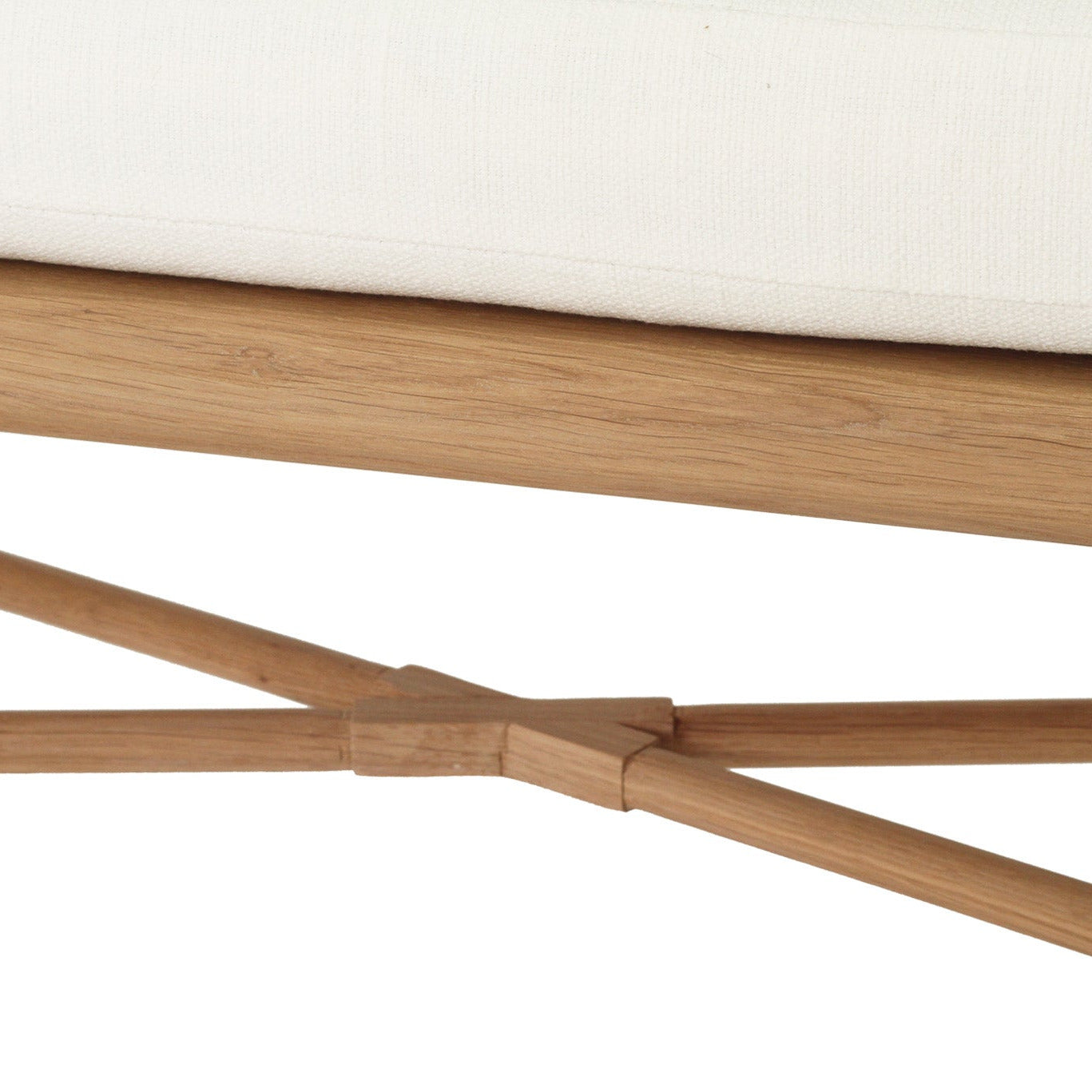Close-up of a wooden bench with a white cushion on a white background
