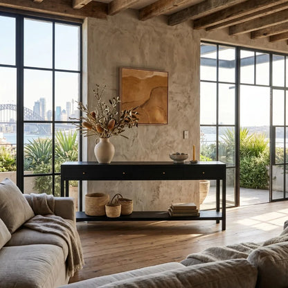 Modern living room with large windows, a console table, and cityscape view.