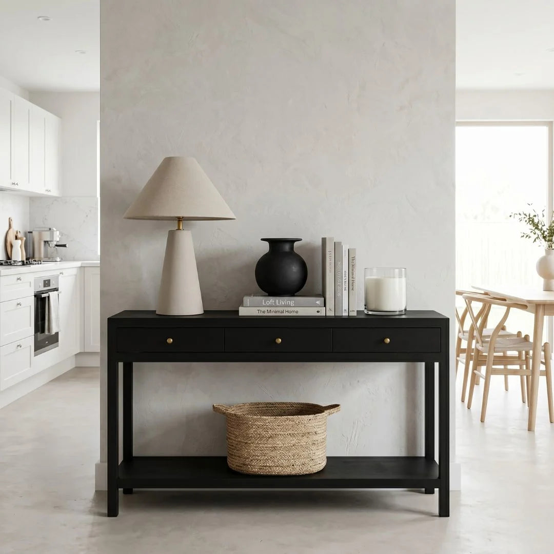 Black console table with decorative items in a modern living room.
