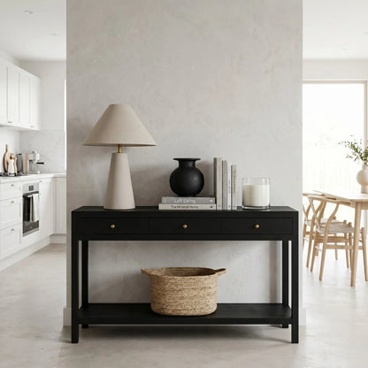 Black console table with decorative items in a modern living room.