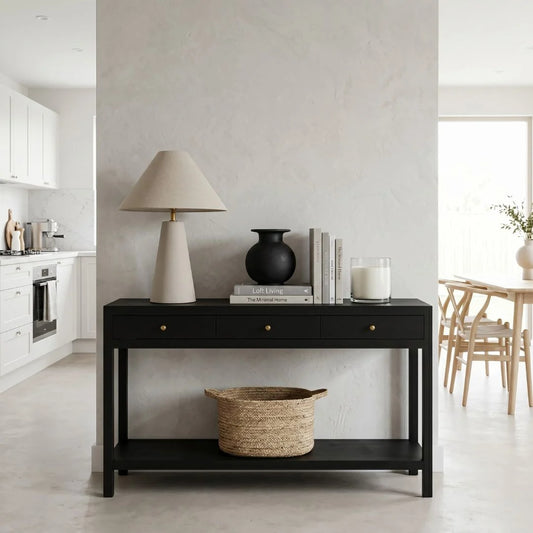 Black console table with decorative items in a modern living room.