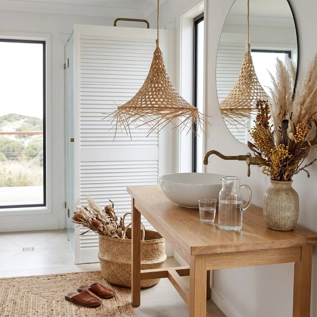 Modern bathroom interior with wooden vanity, wicker basket, and decorative elements.