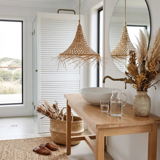 Modern bathroom interior with wooden vanity, wicker basket, and decorative elements.