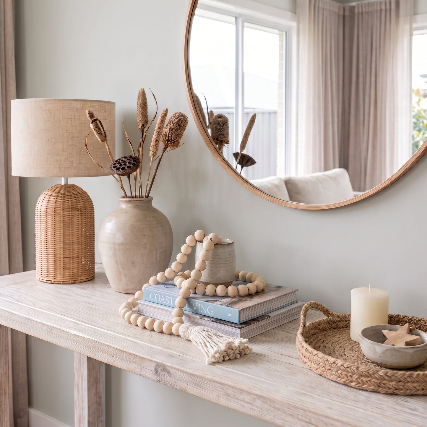 Natural wooden beaded looped garland styled on a console in a modern home.
