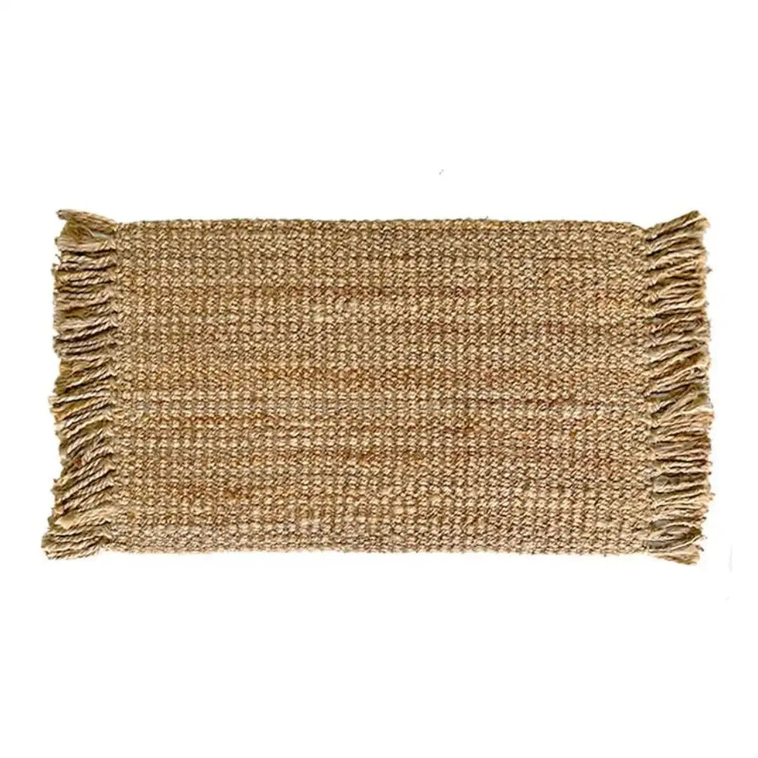 Woven jute mat with fringes on a white background