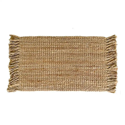 Woven jute mat with fringes on a white background
