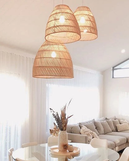 Living room with rattan pendant lights, a sofa, and a coffee table.