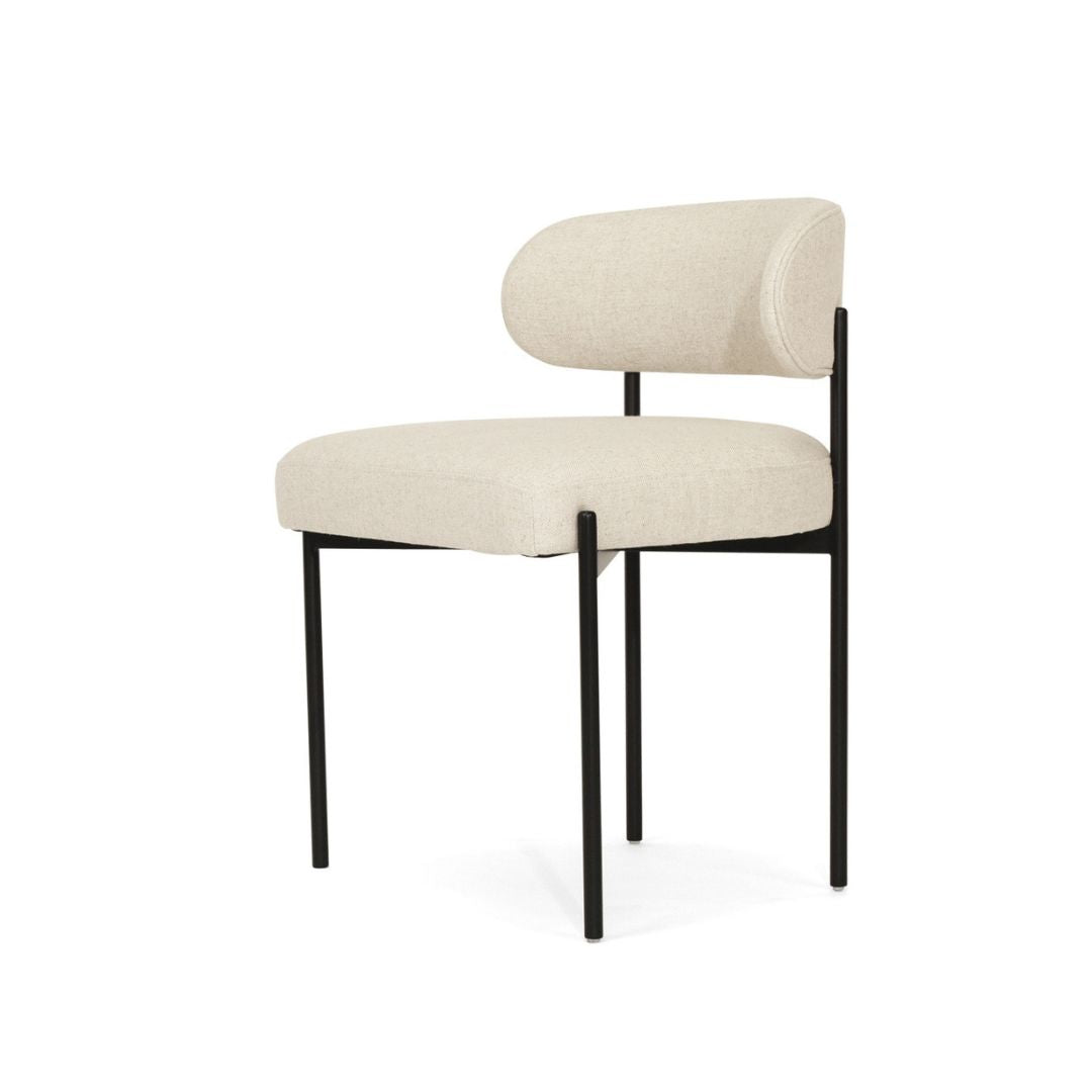 Beige chair with black metal legs on a white background