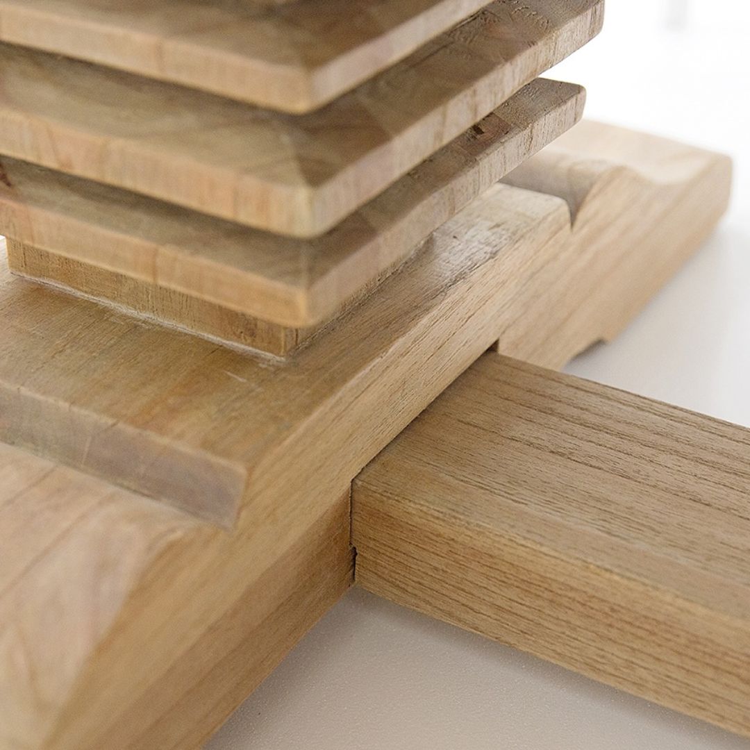 Stack of wooden cutting boards on a light background