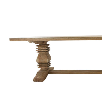 Wooden table with a detailed base on a white background