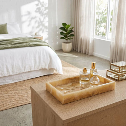Natural Onxy Tray with perfume bottles on a wooden table in a bright bedroom