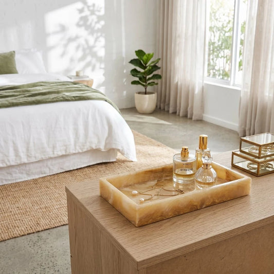 Natural Onxy Tray with perfume bottles on a wooden table in a bright bedroom