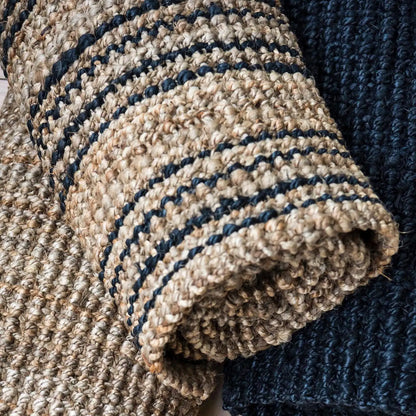 Close-up of textured beige and navy fabric with a woven pattern.