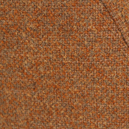 Close-up of a textured tweed fabric in a mottled blend of rust orange, brown, and beige threads, showing a curved seam against a white background.