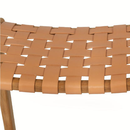 Close-up of a woven leather stool with wooden legs on a white background