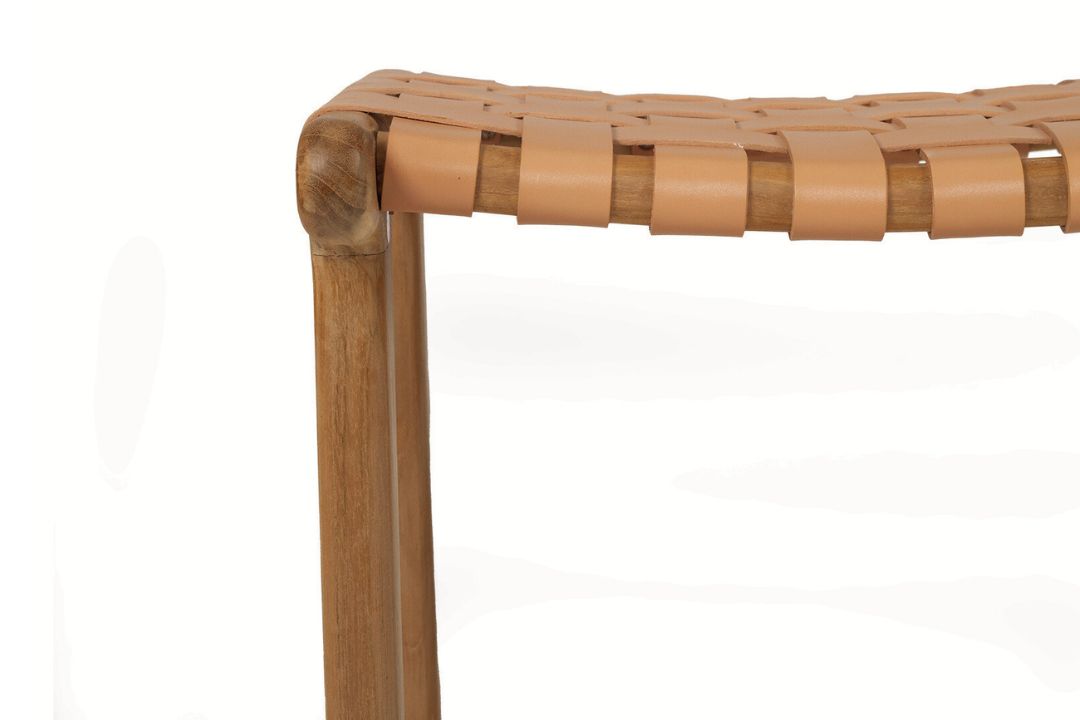 Close-up of a woven leather stool with wooden legs on a white background