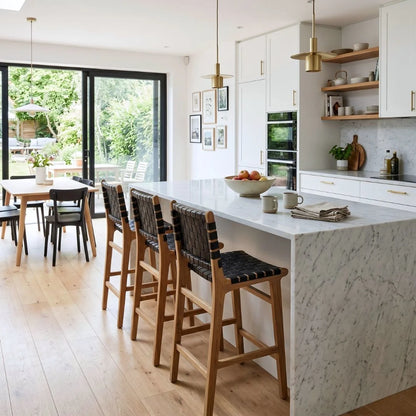 Black woven leather and teak kitchen counter stools in a modern home at a kitchen island bench
