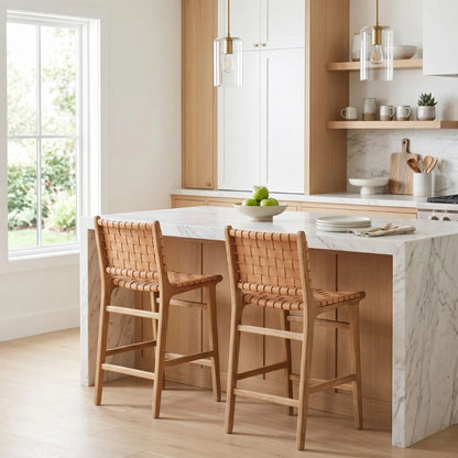 Natural tan woven leather and teak counter stools in a modern kitchen