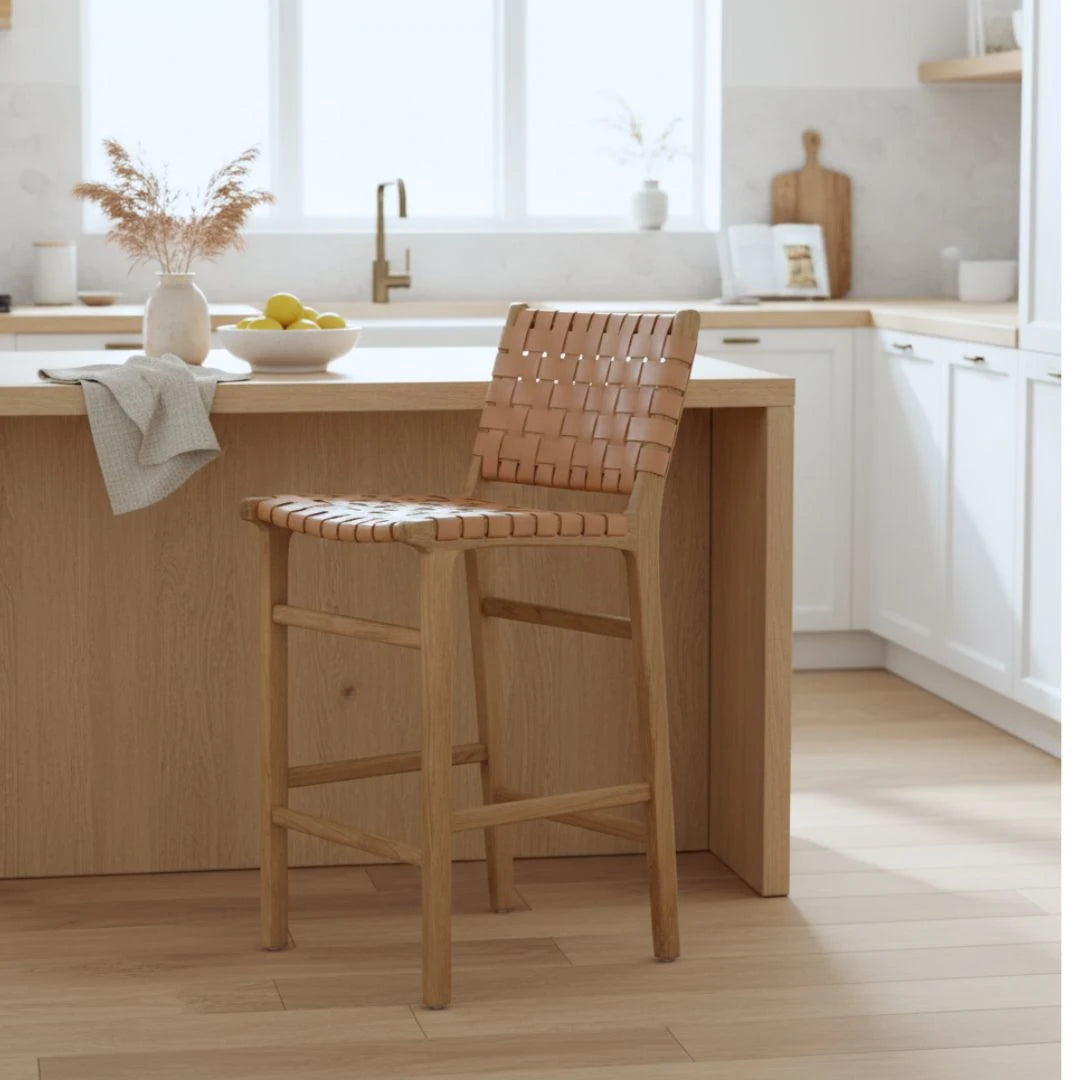 Natural tan woven leather and teak counter stools in a modern kitchen