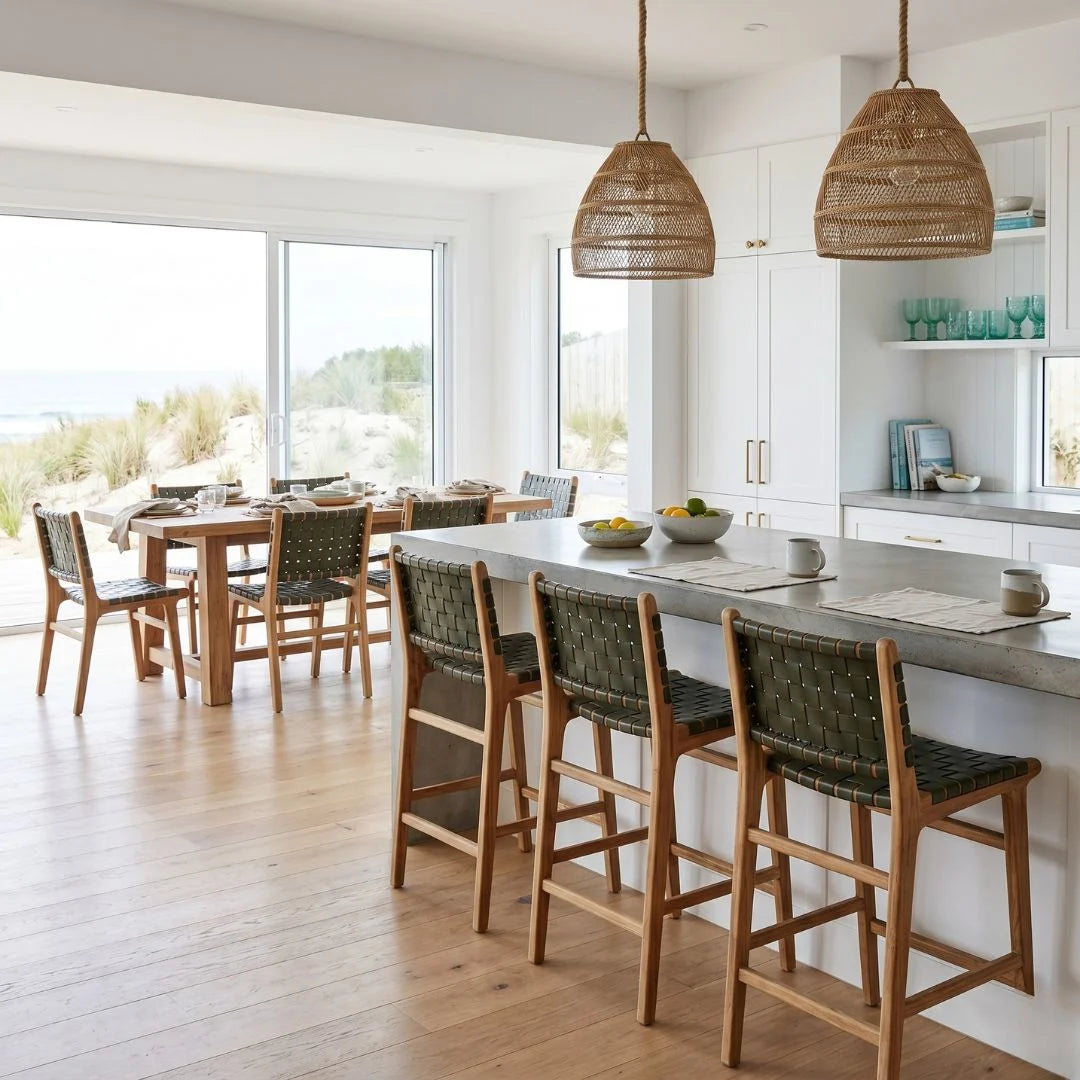 Sun Republic Otis olive leather and teak counter stools at an kitchen island bench in a modern kitchen