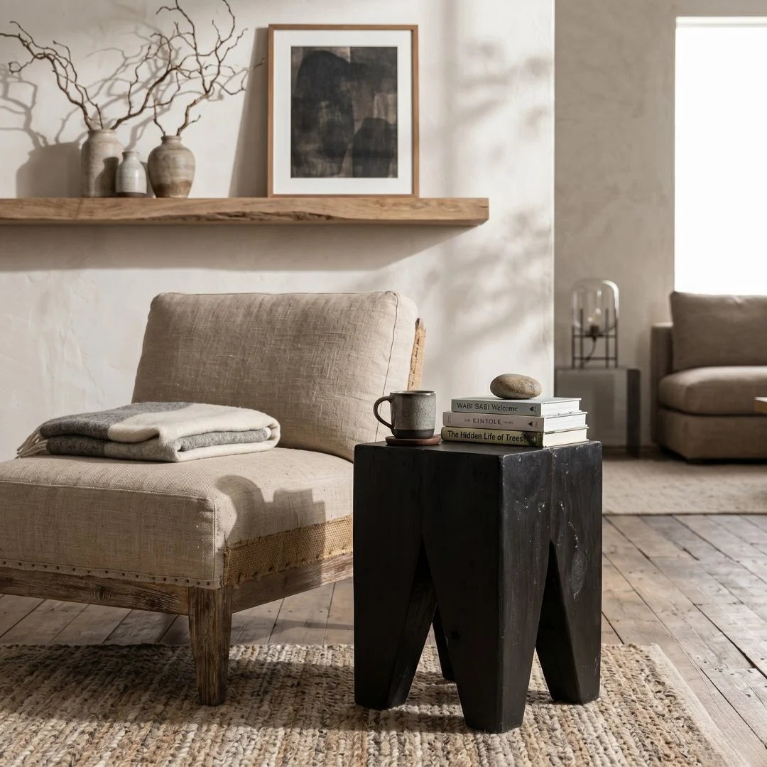 Black Teak square peg stump stool in a rustic wabi sabi style living room